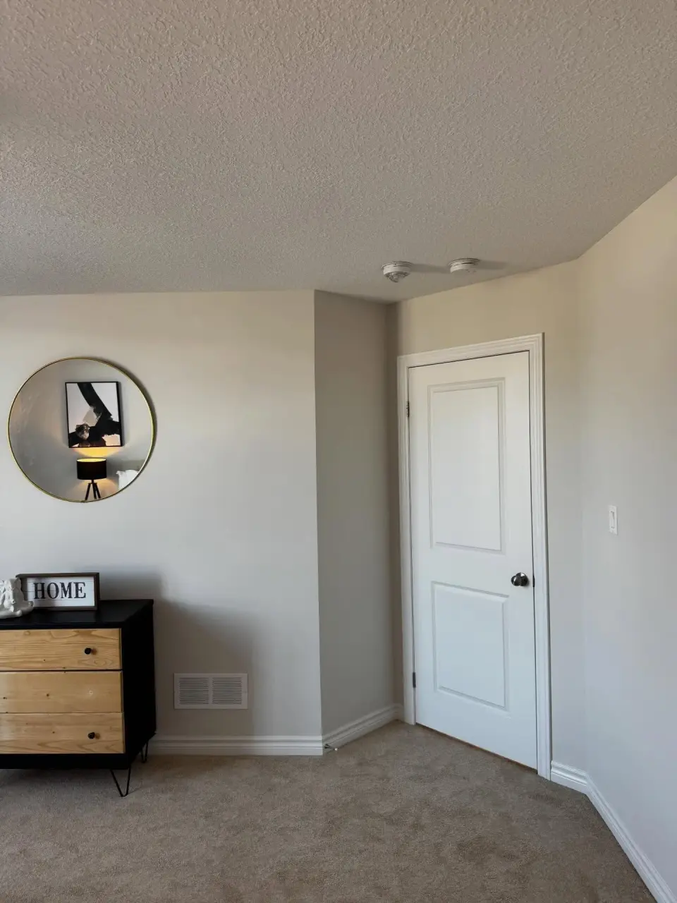 Freshly painted bedroom walls, trim and door